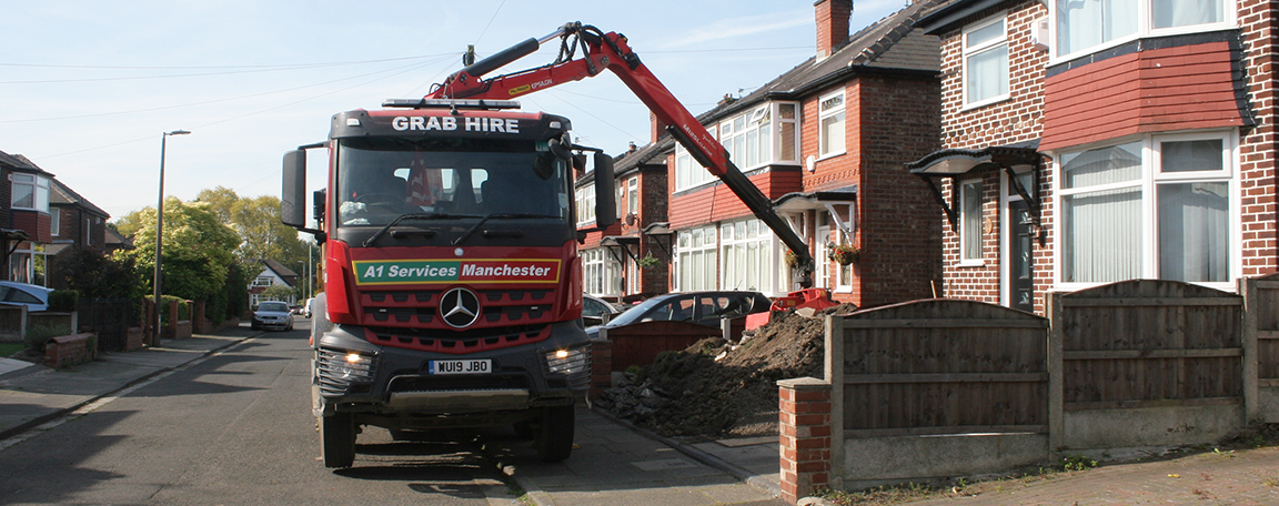 One of our grab trucks collecting waste soil from a domestic building project.